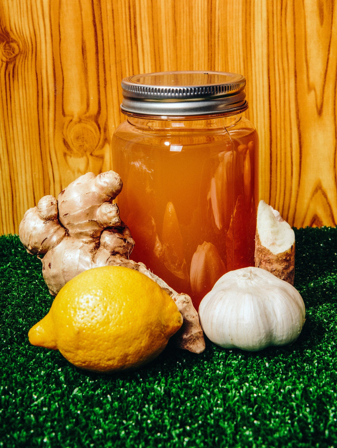 Fire Cider in Mason Jar with lemons, garlic and ginger