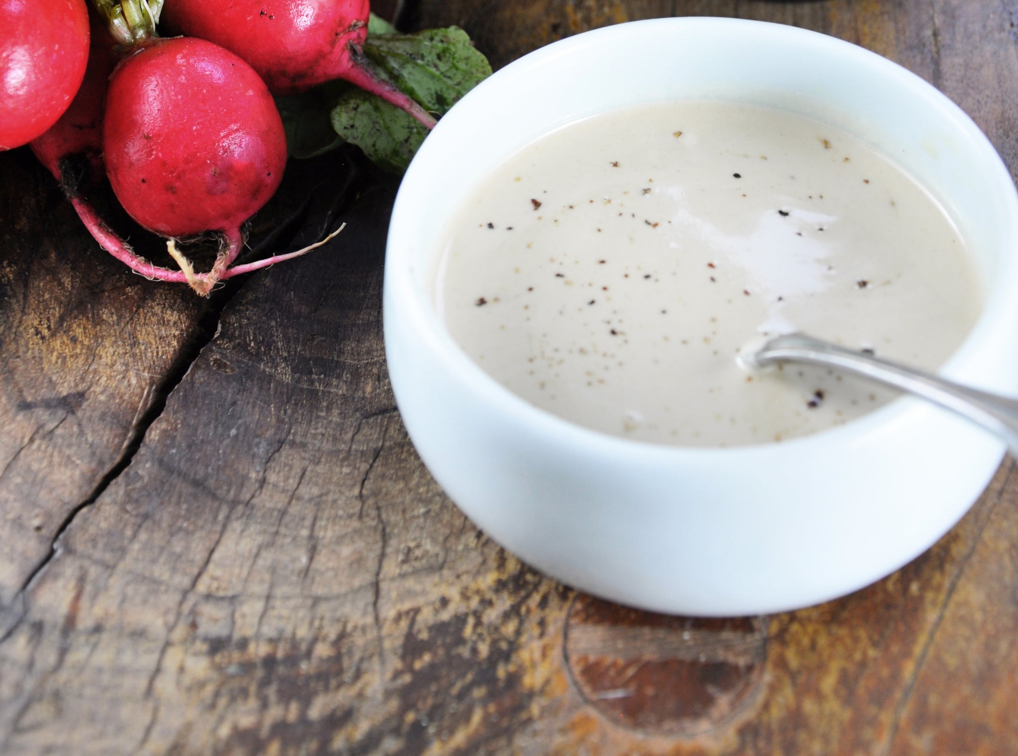 Hany's Harvest Tahini Vinaigrette Recipe. Radishes, salad bowl.